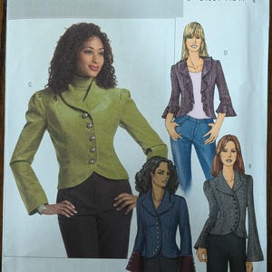 May include: Butterick B4863 sewing pattern featuring jacket designs. The pattern includes various jacket styles with different sleeve and collar options. The image shows illustrations of the finished garments, including a green jacket with a high collar and a purple plaid jacket.