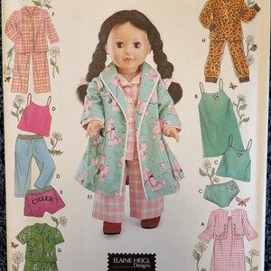 May include: Simplicity sewing pattern 5276 for 18-inch doll clothes. The package features illustrations of various pajama sets, including a teal poodle-print robe, plaid pants, a pink tank top, and a leopard print set. Text includes Simplicity 5276.