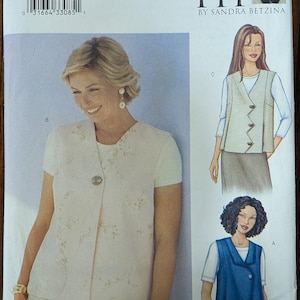 May include: A Butterick sewing pattern, number 3016, featuring a woman wearing a short-sleeved jacket with a floral design. The pattern includes illustrations of different vest styles. The text "TODAY'S FIT" is visible.