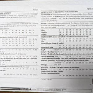 May include: Sewing pattern instructions for a bodysuit and cargo sweatpants. The pattern includes size charts in both inches and centimeters, fabric recommendations, and notions needed for the project. The pattern is for sizes 8 to 26.