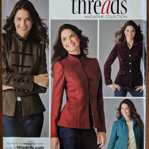 May include: Simplicity sewing pattern 3628 for jackets in sizes K5 8-16. The package features four jacket variations in brown, red, purple, and teal, each with long sleeves and distinct collar styles, displayed on a white background with text.