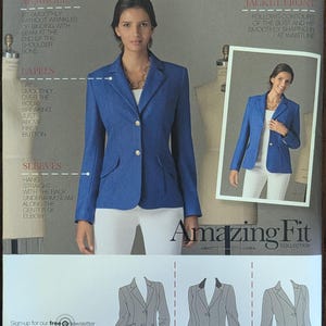 May include: Simplicity pattern 2446 for a blazer. The image shows a woman wearing a blue blazer with gold buttons, white pants, and a necklace. The pattern includes views A, B, and C. The text "Amazing Fit Collection" is visible.