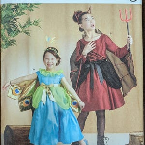 May include: A sewing pattern for two children's costumes. The pattern is for a butterfly costume and a devil costume. The pattern is from Simplicity Costumes and is size 3-6.