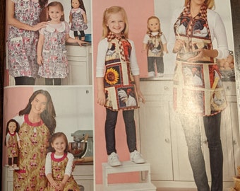May include: A Simplicity sewing pattern for making clothes for 18-inch dolls. The pattern includes instructions for making dresses, aprons, and other accessories. The pattern is designed and printed in the USA.