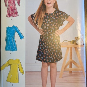 Uncut Simplicity Sewing Pattern #D0909 for Girls/Girls Plus Dress with Neckline, Sleeve and Fabric Variations.  Sizes 8.5 - 16.5