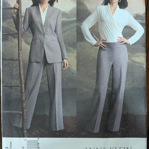 May include: A sewing pattern featuring two women modeling Anne Klein designs. One woman wears a gray suit with a blazer and wide-leg pants. The other wears a white wrap top and gray wide-leg pants. The pattern number is 2759.