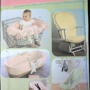 May include: A sewing pattern for baby accessories, including a shopping cart seat cover, glider chair cover, stroller cover, car seat cover, and a basket insert. The pattern is from Simplicity and has the number 4636.
