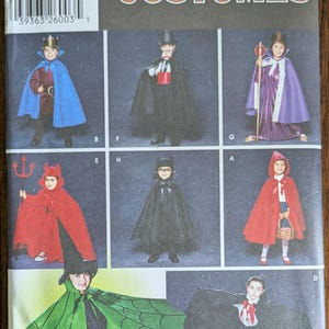 May include: Simplicity Costumes pattern featuring children in various Halloween costumes. Includes a devil, Little Red Riding Hood, a bat, and a vampire. The pattern includes sizes S, M, and L.