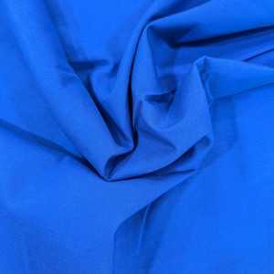 100% Cotton Fabric by the Yard. Country Classics Royal Blue Solid Fabric. 44&quot; Wide. Quilting Cotton Fabric. Apparel Weight Fabric.