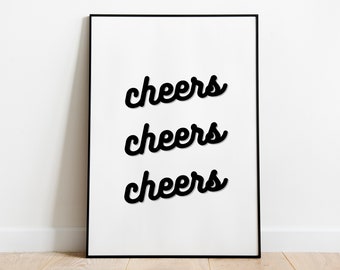 May include: A black and white framed print with the word "cheers" repeated three times in a stylized font.