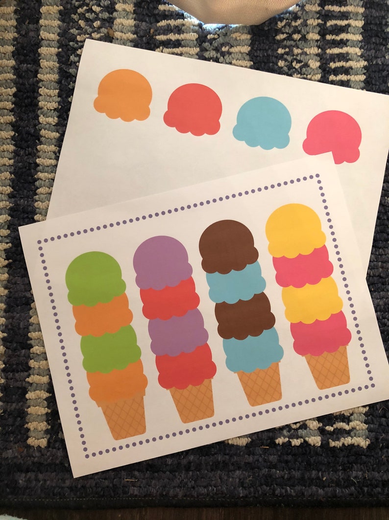 May include: Four ice cream cones with different colored scoops of ice cream. The cones are on a white background with a purple dotted border. The ice cream scoops are green, purple, brown, and pink.