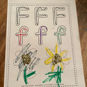 May include: A printable worksheet with the letter F in uppercase and lowercase. The worksheet instructs the user to paint the flowers and add glitter to the inside of each flower. There are two flowers, one is yellow and the other is gray.