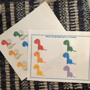 May include: A printable dinosaur matching game with colorful dinosaurs. The game instructs players to "Match the dinosaur baby to its mommy."