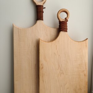 Modern maple charcuterie board with leather handle