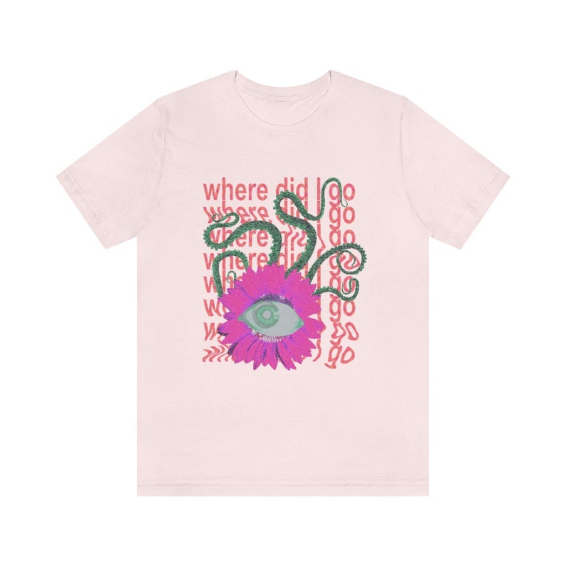 May include: Pink t-shirt featuring a graphic design of a pink flower with an eye in the centre. The flower is surrounded by green vines and the text "where did I go" is repeated multiple times.