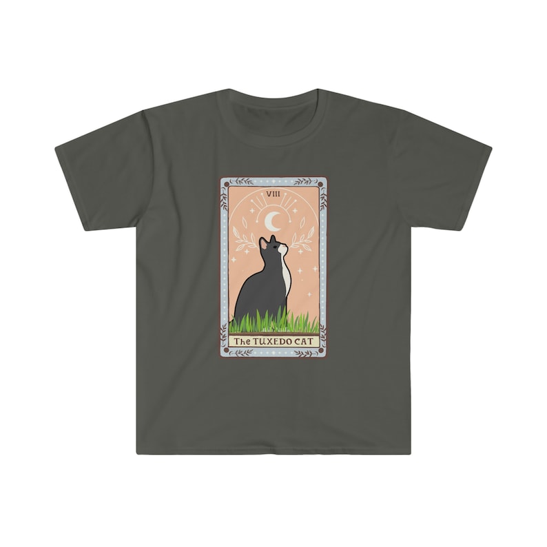 May include: A dark green t-shirt with a tarot card design featuring a black and white cat looking up at a crescent moon. The card is labeled "VIII The Tuxedo Cat".