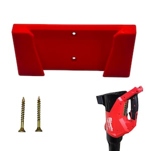 May include: A red power tool holder with two pre-drilled holes, two gold screws, and a red and black power tool. The holder is designed to mount on a wall. The power tool has the brand name "Milwaukee" printed on it.