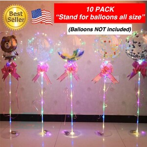 Pode incluir: Um conjunto de 10 suportes para bal&otilde;es transparentes com luzes LED. Cada suporte tem uma fita rosa e uma base de pl&aacute;stico transparente. Os suportes s&atilde;o projetados para segurar bal&otilde;es de v&aacute;rios tamanhos. "10 PACK "Stand for balloons all size" (Balloons NOT included)"