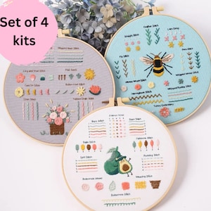 May include: Set of four embroidery kits featuring different designs, including a bouquet of flowers, a bee, and an avocado. Each kit comes with a hoop, fabric, and embroidery floss. The hoops are made of wood and have a natural finish. The fabric is white and the embroidery floss is in a variety of colours.