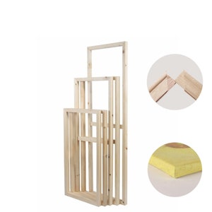 May include: Four wooden canvas stretcher bars of different sizes stacked on top of each other. The bars are made of natural wood and have a smooth finish. The bars are joined together at the corners with mitered joints.