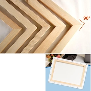 May include: Close-up of wooden stretcher bars for a canvas, showing the 90-degree corners. The bars are made of natural wood and are stacked on top of each other. The image also shows a white canvas stretched over the bars.