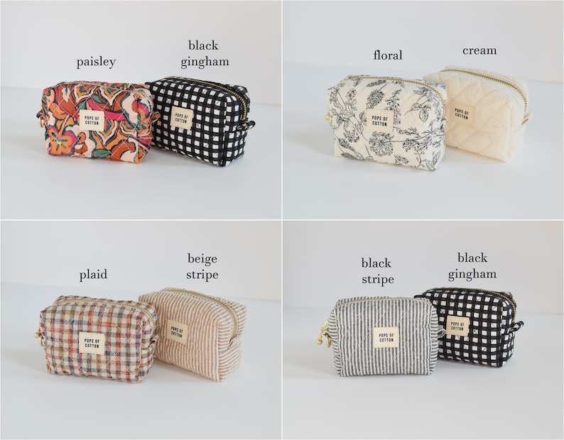 May include: A collection of small, zippered cosmetic bags in various patterns. The bags include paisley, black gingham, floral, cream, plaid, beige stripe, and black stripe designs. Each bag has a small label that reads "POPE OF COTTON".