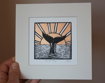 Whale tail at sunset, original, hand coloured, mounted lino print