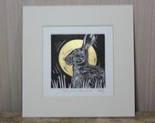 Hare and golden moon, original, hand coloured, mounted lino print