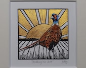 Pheasant at sunrise, original, hand coloured, mounted lino print