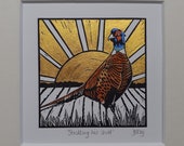 Strutting his stuff - original, hand painted, mounted linocut print of a pheasant at sunrise