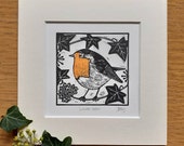 Winter robin, original, hand coloured, mounted lino print
