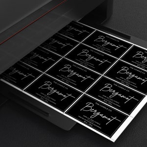 May include: A sheet of black and white labels with the text "THE CANDLE CO. Bergamot 100% Soy Wax Candle Created With Love In California" printed on each label.