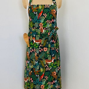 Bib Apron in Rifle Paper Mernagerie Jungle Canvas in Hunter with Pockets and Adjustable Neck Strap (Style modeled in photos)