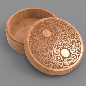 May include: A round wooden box with a lid featuring a carved Yin and Yang design. The box is made of light brown wood and the lid is partially open, revealing the interior. The Yin and Yang symbol is intricately carved with floral patterns.