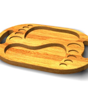 May include: A wooden serving tray with two foot-shaped cutouts. The tray has two handles on the sides and is made of light brown wood.