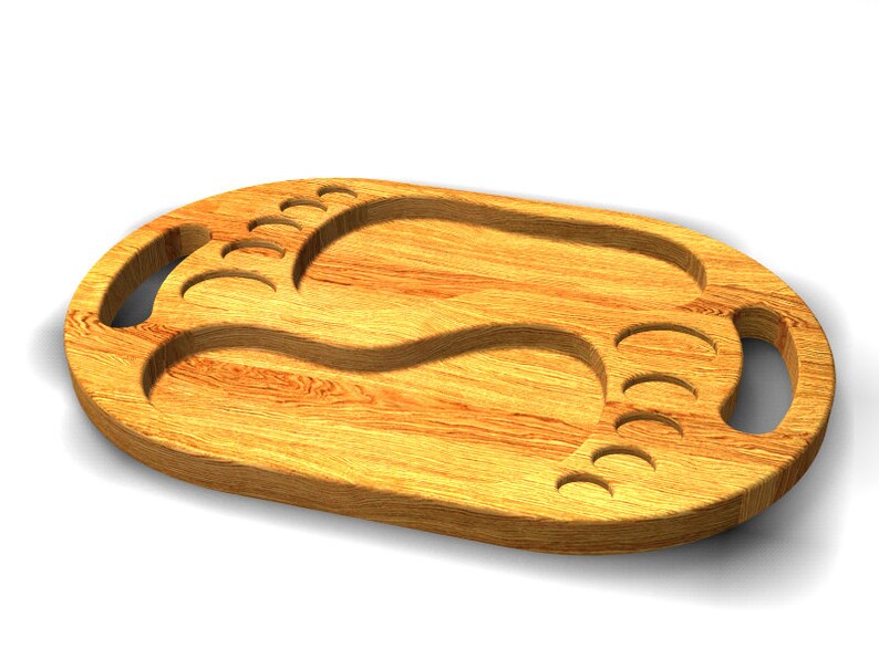 May include: A wooden serving tray with two foot-shaped cutouts. The tray has two handles on the sides and is made of light brown wood.