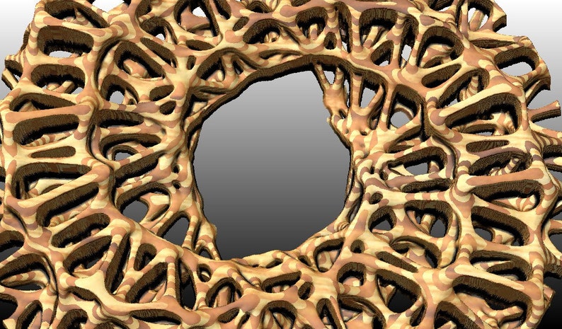 May include: An abstract design in brown and beige with a circular hole in the centre. The design is made up of intricate, swirling patterns.
