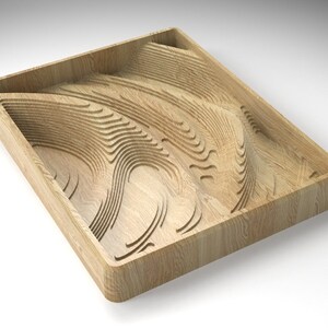 May include: A wooden tray with a carved, undulating design. The tray is made of light wood and has a rectangular shape.