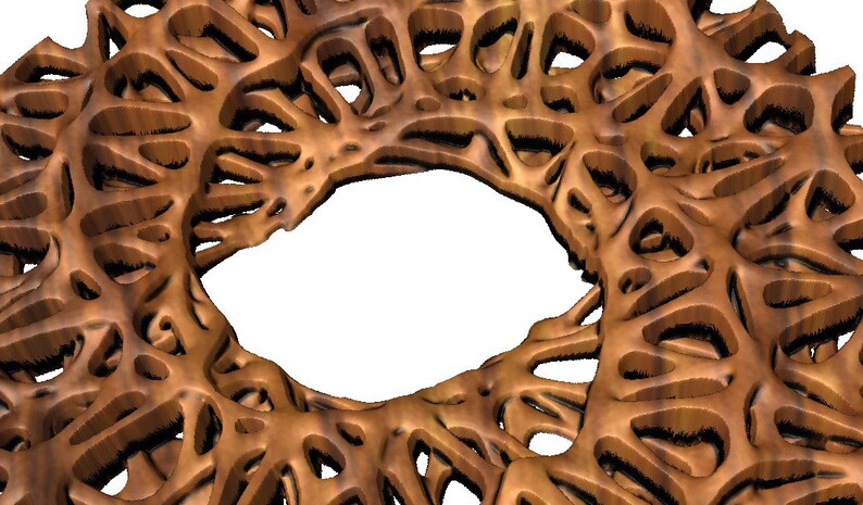 May include: A wooden decorative wall hanging with a circular design featuring intricate cutouts. The design resembles a stylised flower or a mandala with a central hole.