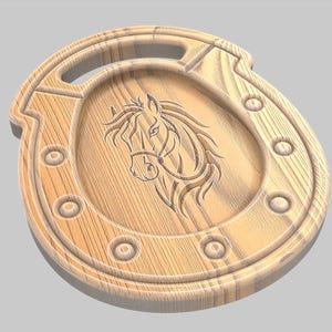 May include: Wooden horseshoe-shaped decorative item with a carved horse head design. The light brown wood has a handle and is accented with circular details. A rustic, equestrian-themed piece.