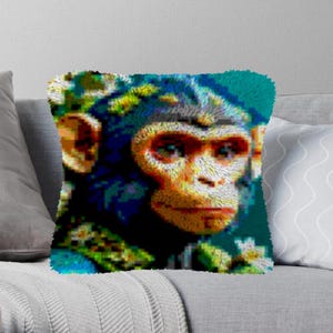 May include: A close-up of a colorful, pixelated image of a monkey's face. The monkey has blue eyes, a brown nose, and a furry face. The background is a blurry, green and blue color.