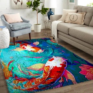 May include: A colorful rug with a blue background and a design of orange, red, and white koi fish swimming in a pond. The rug has a soft, plush texture.