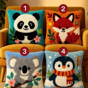 May include: Four square throw pillows with animal designs. A panda, fox, koala, and penguin are featured on the pillows. The panda is on a teal background, the fox on orange, the koala on blue, and the penguin on a snowy blue background.