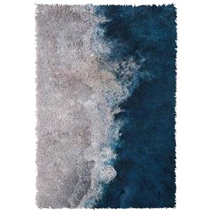 May include: A blue and gray abstract rug with a gradient design. The rug has a soft, fluffy texture.
