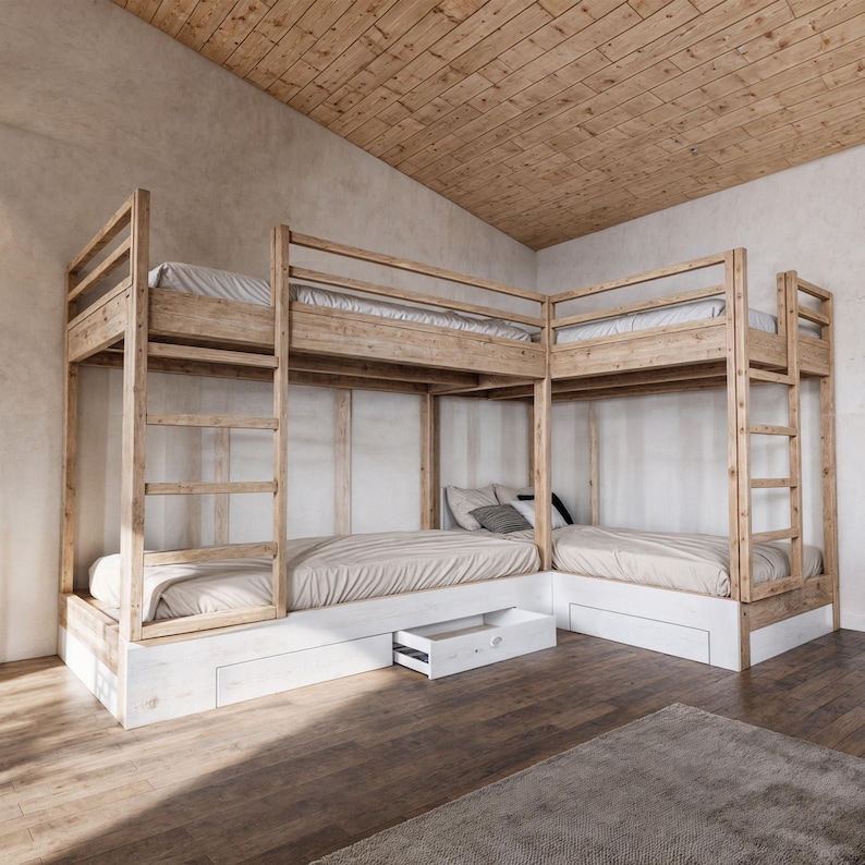 May include: A wooden bunk bed with a corner design. The bed has a white painted finish and includes drawers for storage.
