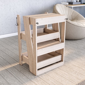 May include: A wooden step stool with three shelves and two hooks. The stool is made of light wood and has a natural finish.
