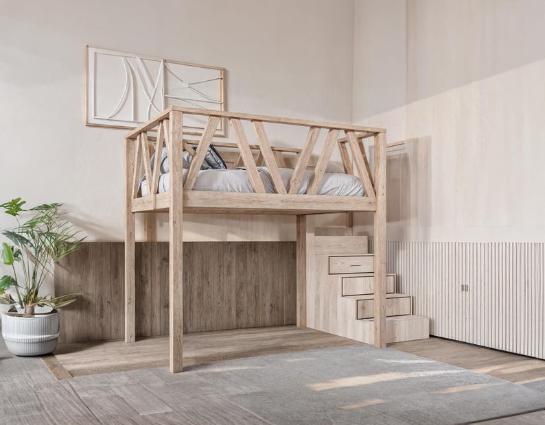 May include: A wooden loft bed with a slatted frame and a ladder. The bed is painted in a light wood stain and has a white wall behind it.