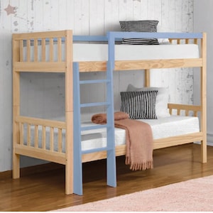 May include: A wooden bunk bed with a light blue ladder. The top bunk has a white mattress and a blue and white patterned pillow. The bottom bunk has a white mattress and a brown blanket.