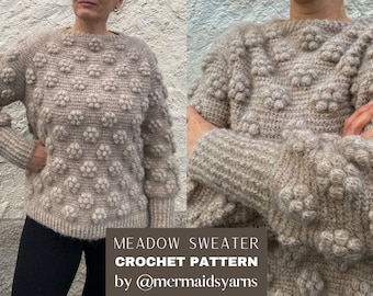 May include: A beige crochet sweater with a textured bobble stitch pattern. The sweater has a round neckline and long sleeves. The text "MEADOW SWEATER CROCHET PATTERN by @mermaidsyarns" is at the bottom of the image.