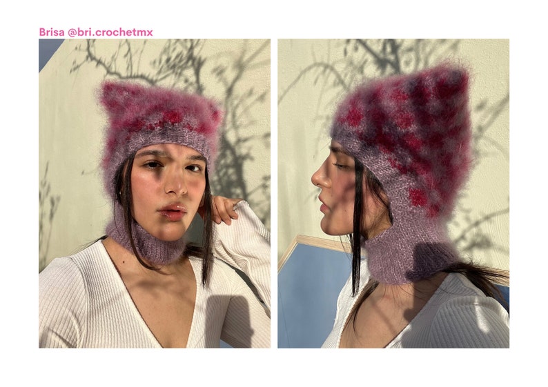 May include: A lilac-coloured, handmade, two-piece hat and neck warmer set. The hat features pointed ears and a checkered pattern in pink and red. The text "Brisa @bri.crochetmx" is visible in the top left corner.